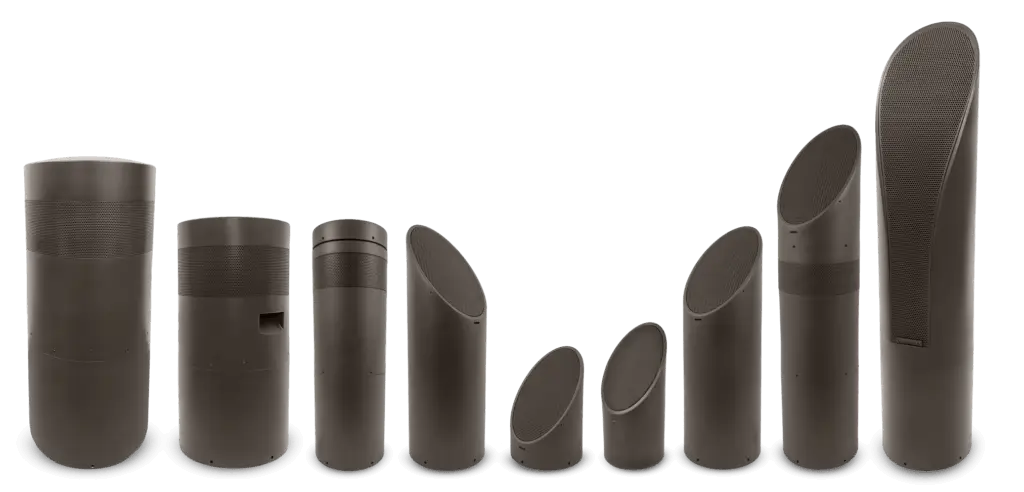 Conscape Lighting + Audio Nine modern, cylindrical outdoor speakers by Conscape Lighting + Audio stand in ascending order from left to right, each with varying heights and angled tops, set against a plain background.